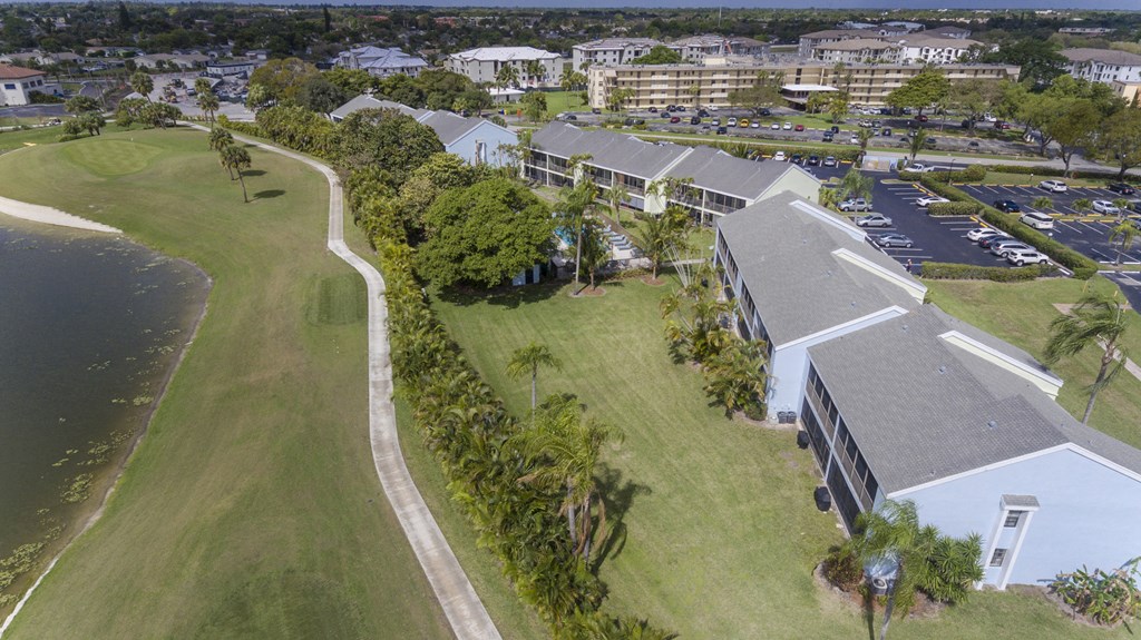 A building with a parking lot in front of it.